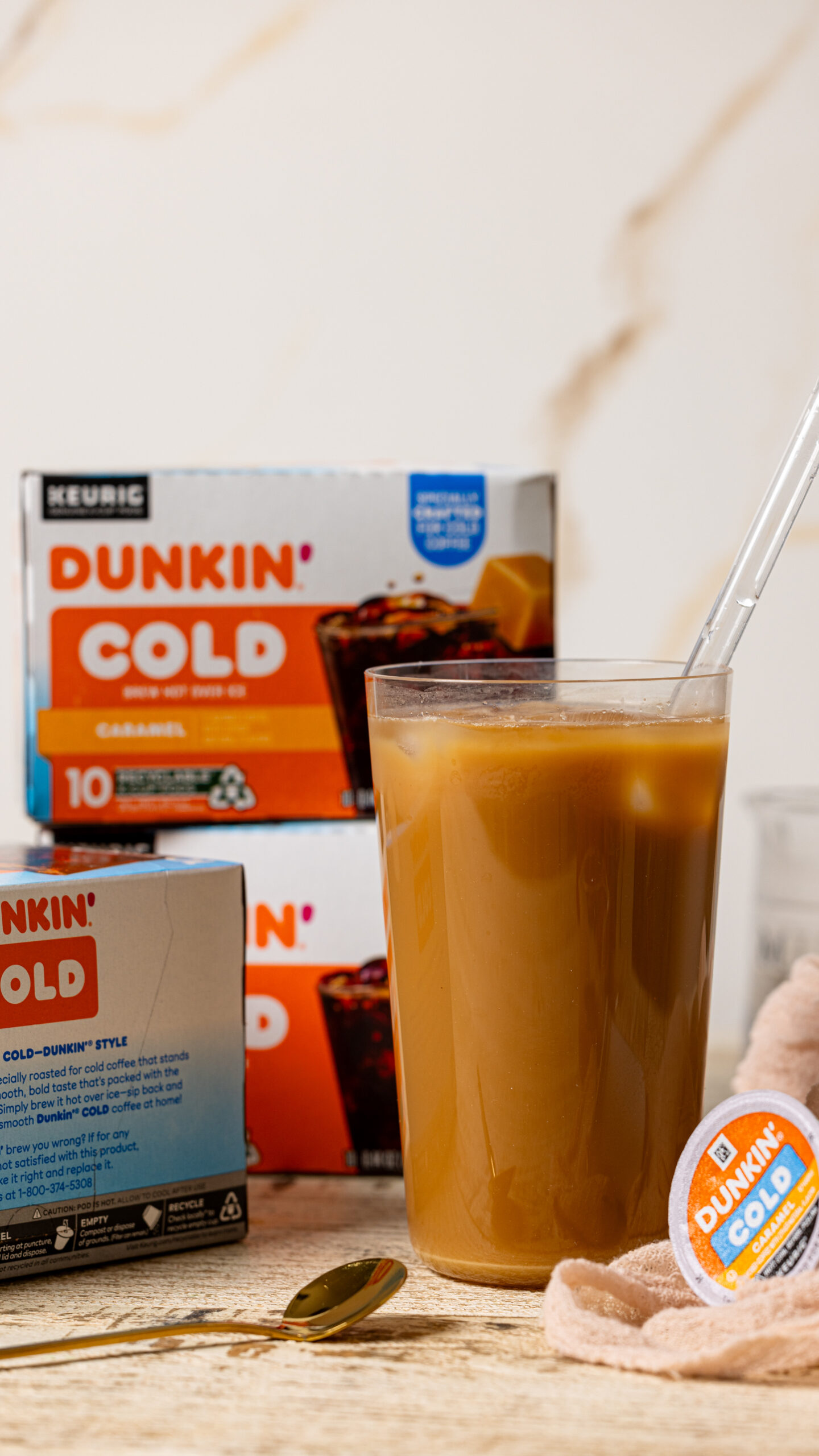 Photo of Dunkin' products with a glass of latte.